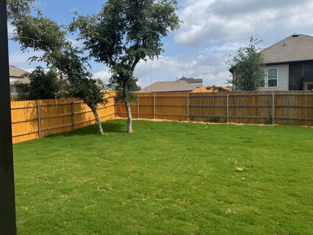 view of yard featuring a fenced backyard