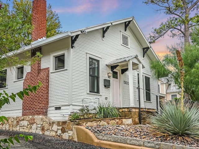 view of front of property with a chimney