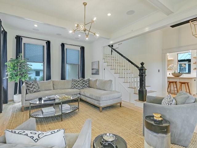 living room with stairs, beamed ceiling, wood finished floors, and recessed lighting