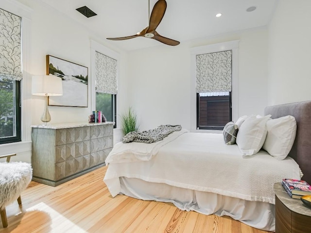 bedroom featuring multiple windows, wood finished floors, a ceiling fan, and recessed lighting