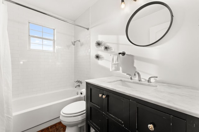 bathroom featuring vanity, wood finished floors, shower / bath combination with curtain, and toilet