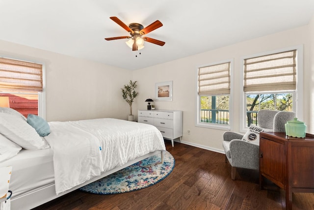 bedroom featuring ceiling fan, baseboards, and hardwood / wood-style flooring