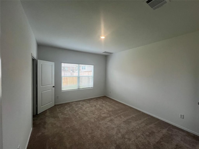151 Cibolo Creek Loop, Bastrop, TX 78602 - unfurnished room with dark colored carpet and baseboards