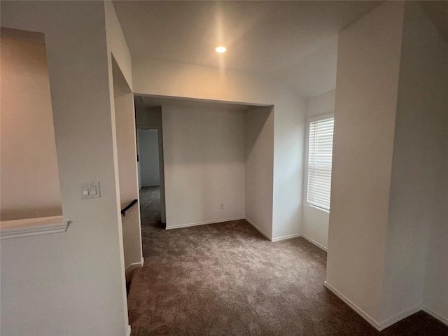 151 Cibolo Creek Loop, Bastrop, TX 78602 - unfurnished bedroom with carpet floors, baseboards, and lofted ceiling