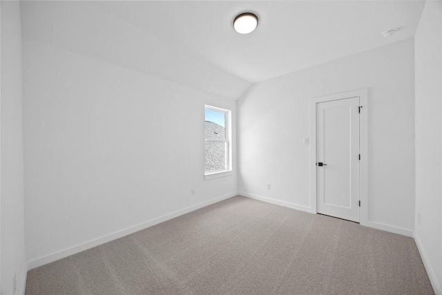 5804 Kelly Kyle Ave, Georgetown, TX 78628 - spare room featuring carpet flooring, lofted ceiling, and a smoke detector