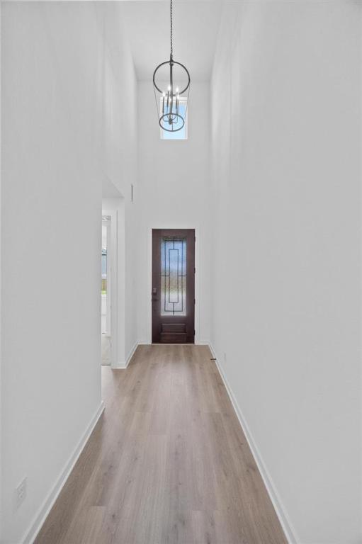 5804 Kelly Kyle Ave, Georgetown, TX 78628 - entryway with a chandelier and light wood-style flooring