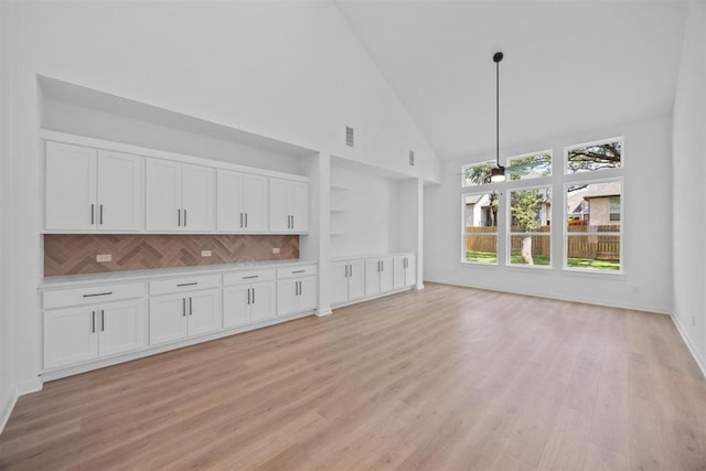 5804 Kelly Kyle Ave, Georgetown, TX 78628 - unfurnished living room featuring high vaulted ceiling and light wood-type flooring