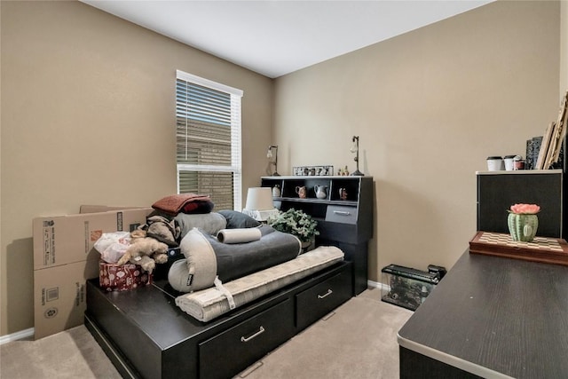 bedroom featuring baseboards and light colored carpet