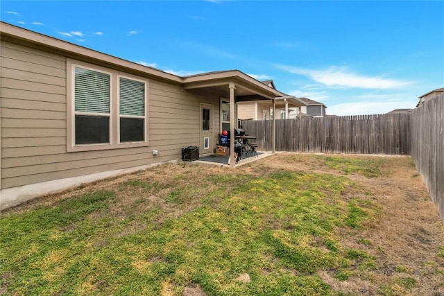 view of yard with a patio area and a fenced backyard