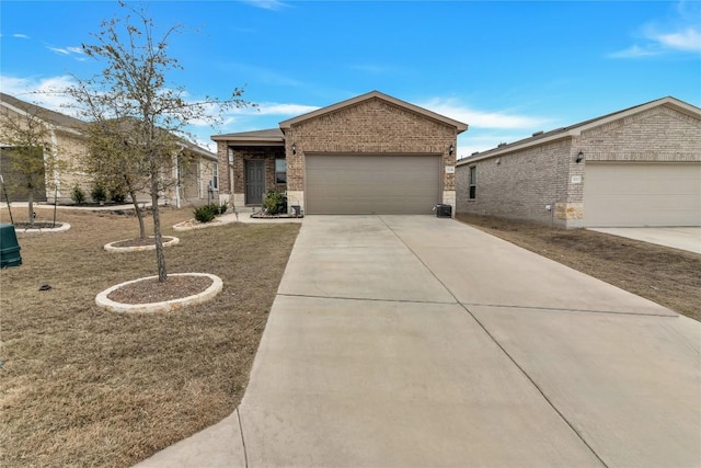 view of front of house with a garage, concrete driveway, and brick siding