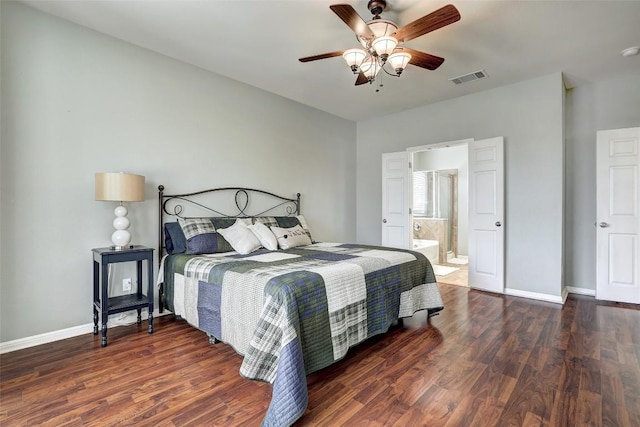 bedroom with visible vents, baseboards, and wood finished floors