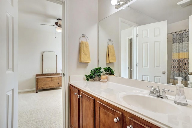 bathroom featuring ceiling fan and vanity