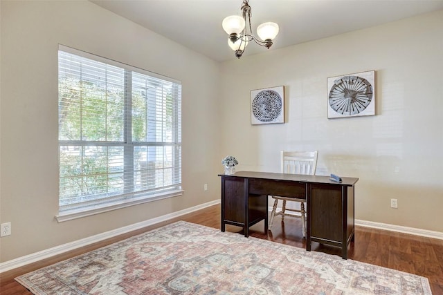 office area with plenty of natural light, baseboards, and dark wood-type flooring