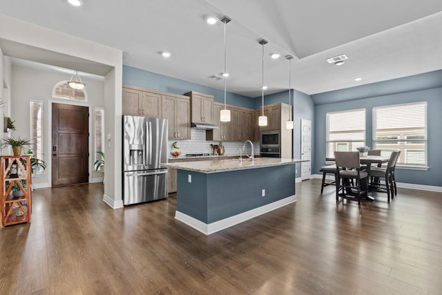 kitchen featuring stainless steel appliances, dark wood-type flooring, visible vents, and decorative backsplash