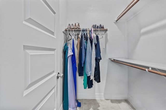 walk in closet featuring tile patterned floors