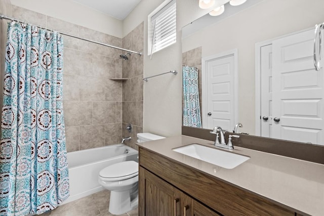 bathroom featuring toilet, vanity, shower / tub combo with curtain, and tile patterned floors