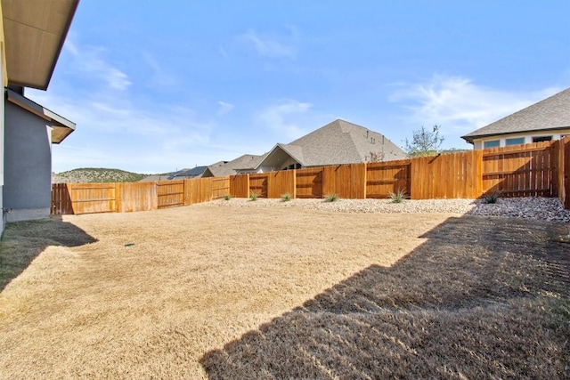 view of yard with a fenced backyard