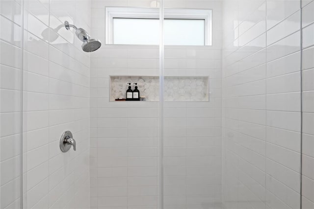 full bathroom with a stall shower and plenty of natural light