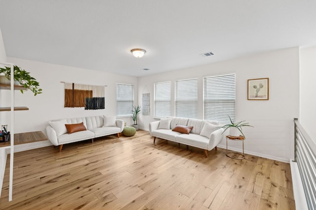 12102 Tolson Dr, Manor, TX 78653 - living room featuring light wood finished floors and baseboards