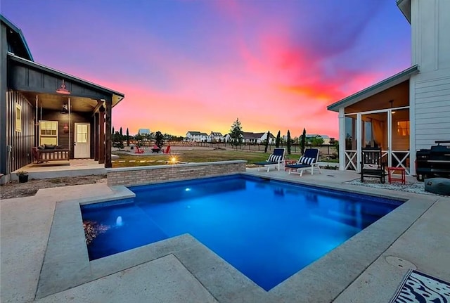 outdoor pool featuring a patio