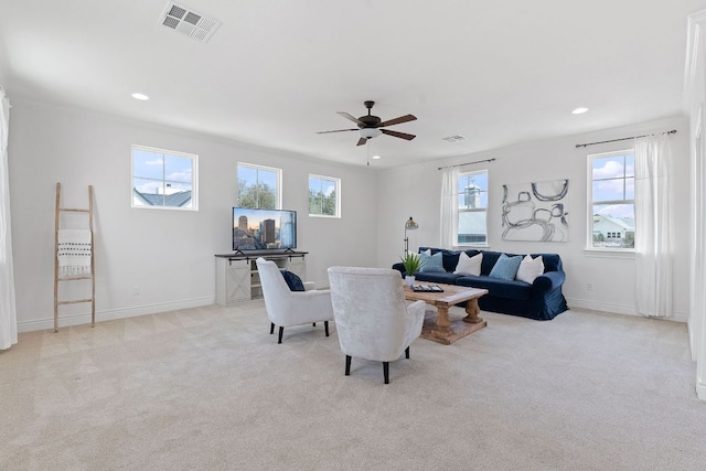 living room with carpet floors, baseboards, visible vents, and recessed lighting