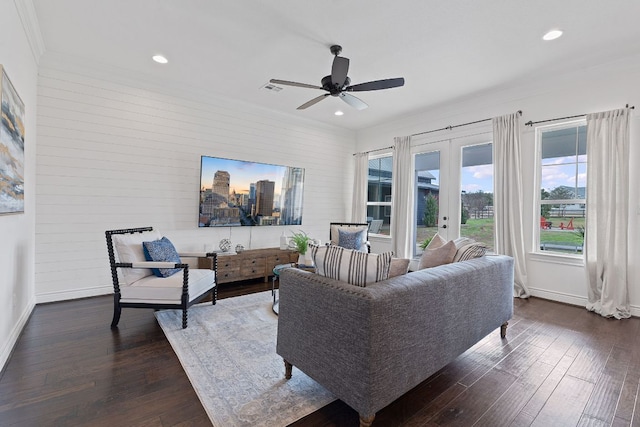 living room featuring french doors, baseboards, and dark wood-style flooring