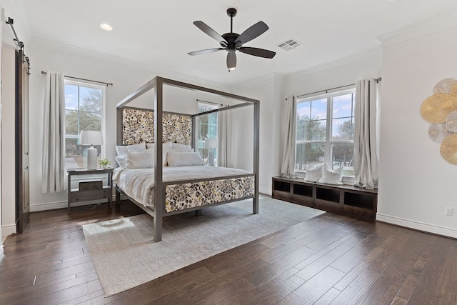 bedroom featuring multiple windows, visible vents, dark wood-style flooring, and ornamental molding