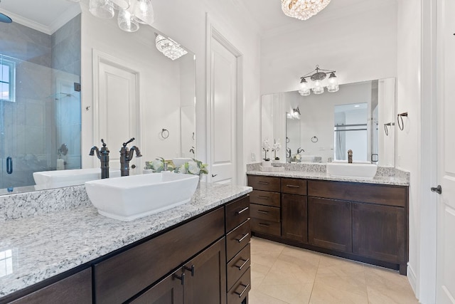 bathroom featuring a stall shower and a sink