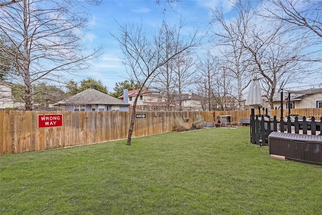 view of yard with a fenced backyard