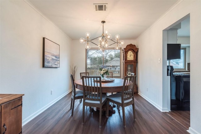 dining area featuring baseboards, visible vents, dark wood-style flooring, and crown molding