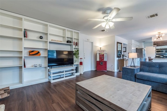 living room featuring a ceiling fan, visible vents, and dark wood-type flooring