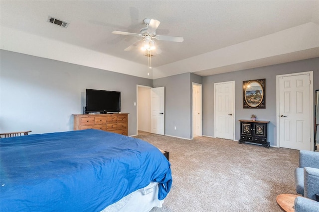 bedroom with a ceiling fan, carpet flooring, visible vents, and baseboards