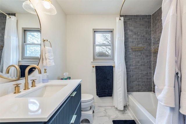 bathroom with marble finish floor, shower / tub combo, vanity, and toilet