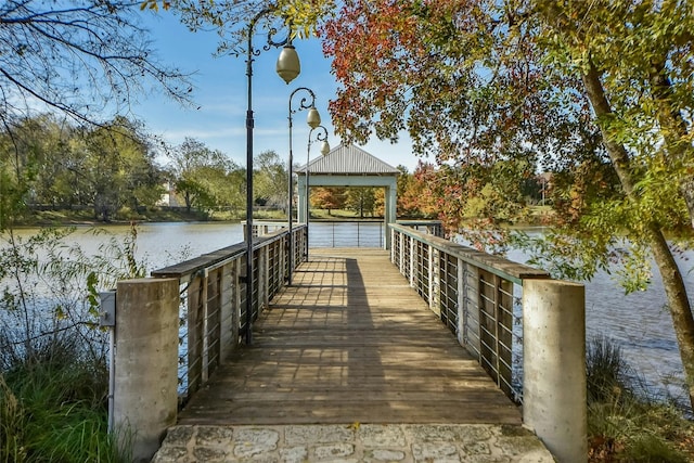 dock area with a gazebo and a water view