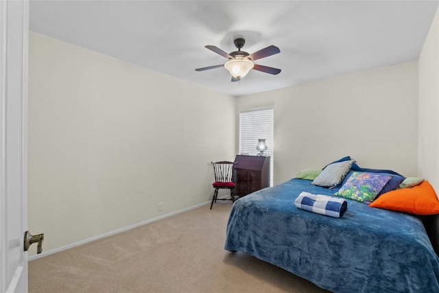 bedroom with carpet floors, ceiling fan, and baseboards