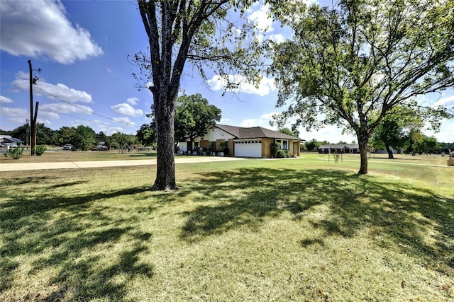 view of yard featuring a garage