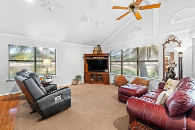 living area featuring high vaulted ceiling, carpet, crown molding, and a ceiling fan