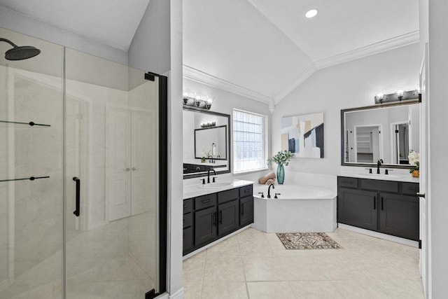 bathroom with a stall shower and a sink