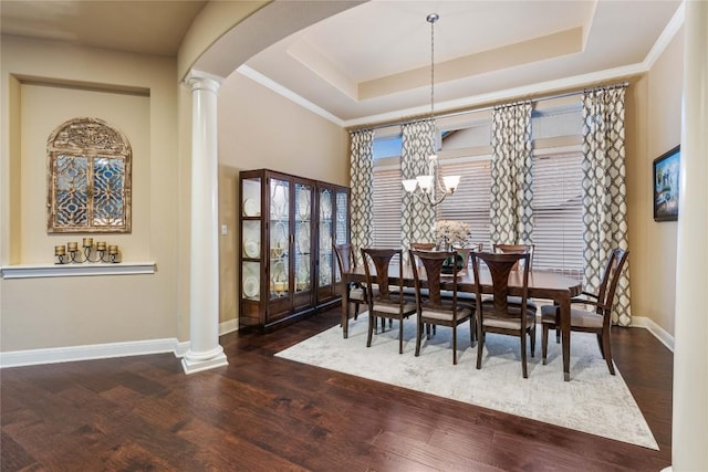 2717 Rain Song Dr, Leander, TX 78641 - dining space featuring arched walkways, baseboards, wood finished floors, and a chandelier