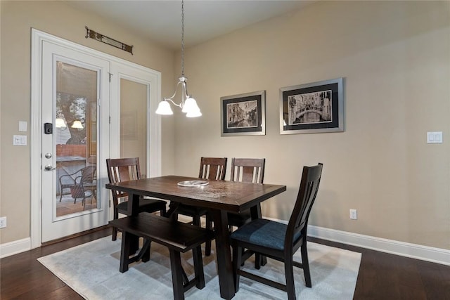 2717 Rain Song Dr, Leander, TX 78641 - dining space with baseboards, a chandelier, and dark wood-style flooring