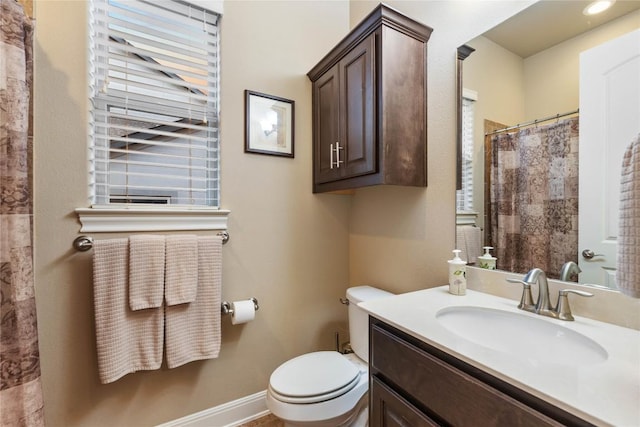 2717 Rain Song Dr, Leander, TX 78641 - bathroom with vanity, toilet, and baseboards