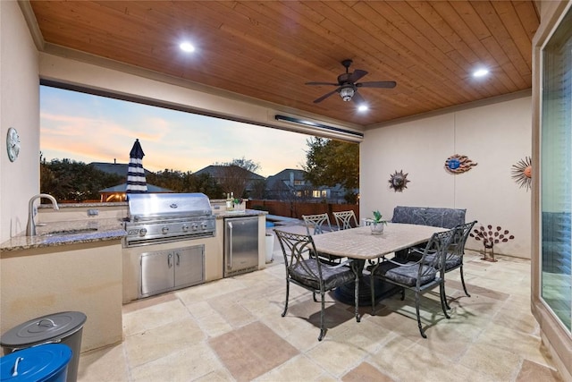 2717 Rain Song Dr, Leander, TX 78641 - patio terrace at dusk with a patio area, a sink, outdoor dining space, and a ceiling fan