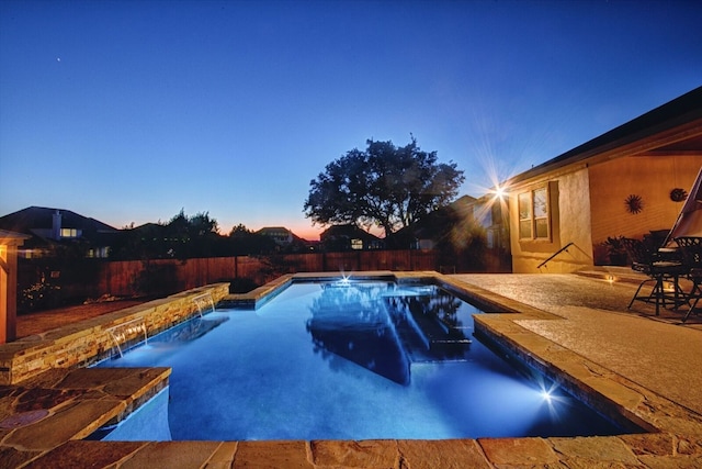 2717 Rain Song Dr, Leander, TX 78641 - pool at dusk featuring a fenced backyard and a patio