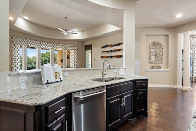 2717 Rain Song Dr, Leander, TX 78641 - kitchen with a sink, dishwasher, a tray ceiling, a ceiling fan, and decorative backsplash