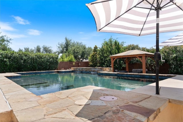 2717 Rain Song Dr, Leander, TX 78641 - view of pool with a gazebo, a patio, and a fenced backyard