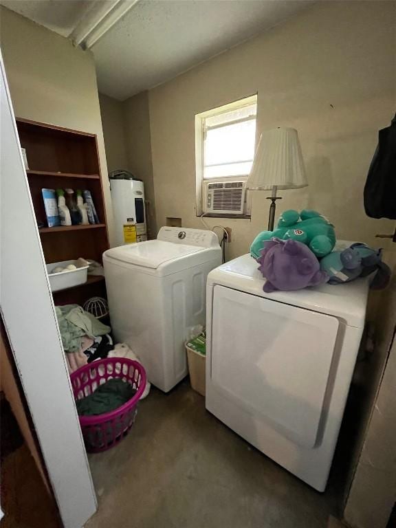 laundry area with laundry area, water heater, cooling unit, and independent washer and dryer