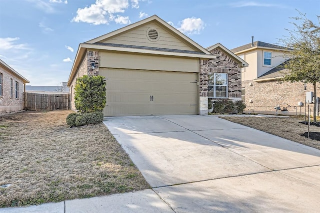 ranch-style home featuring an attached garage, fence, concrete driveway, and brick siding