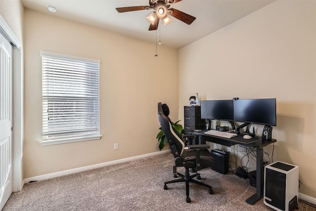 office featuring carpet, ceiling fan, and baseboards