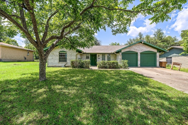 ranch-style house featuring an attached garage, concrete driveway, brick siding, and a front yard