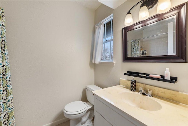 full bathroom with toilet, curtained shower, and vanity